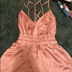 Light pink polyester romper.